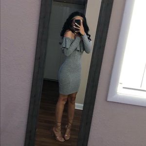 A grey long sleeve bodycon dress